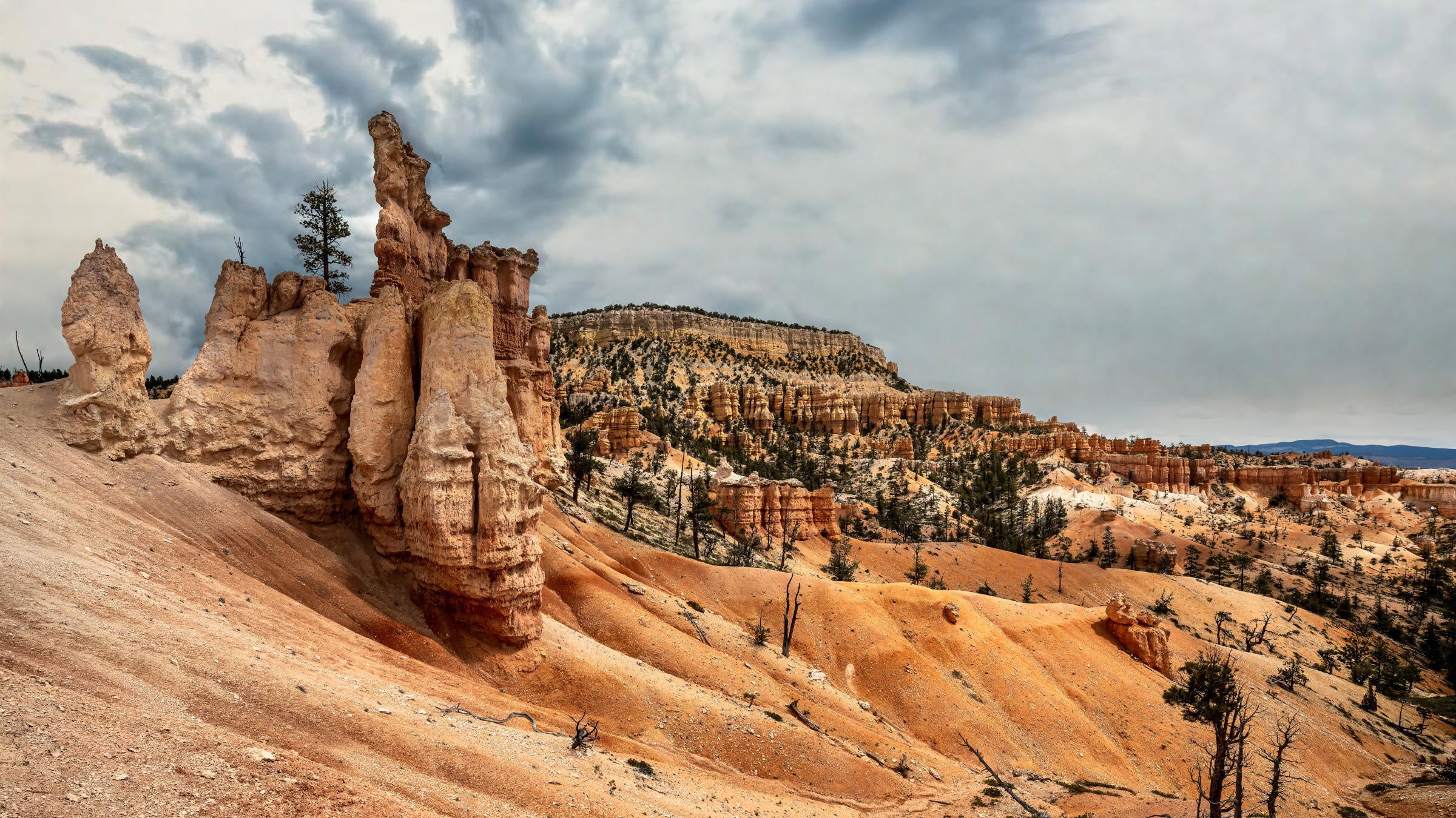 Red and orange desert canyon with blue sky in background