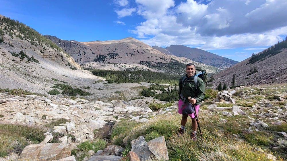 hiking man along ridgeline