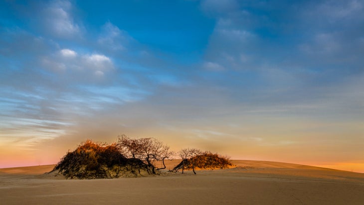 Sand dune and sunrise