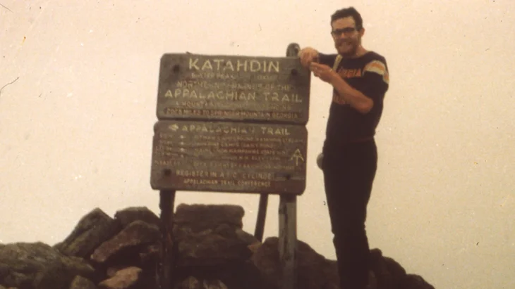 hiker on top of Katahdin