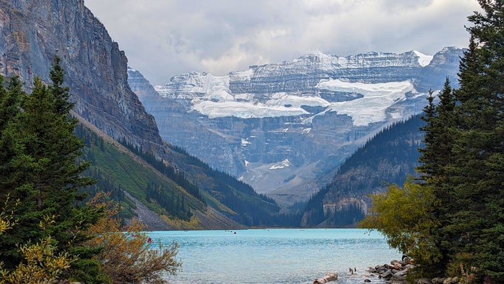 Blue lake with mountains in background