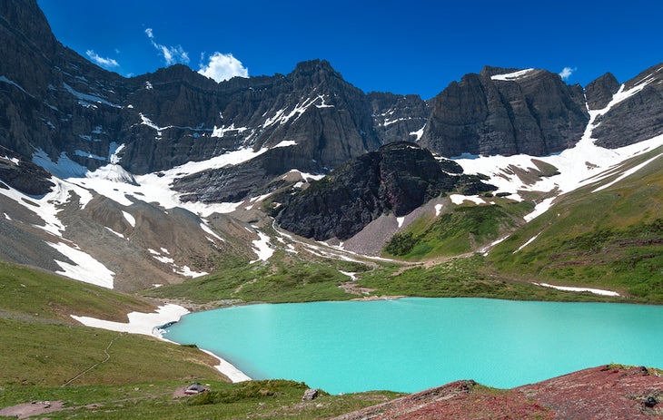 Overlook of Cracker Lake with surrounding rocky mountain, Glacier National Park, Montana