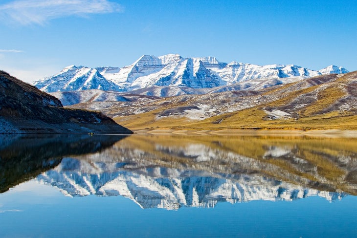 Refection of snow covered Mount Timpanogos in Deer Creek Reservoir, near Heber City, Utah in Provo Canyon.