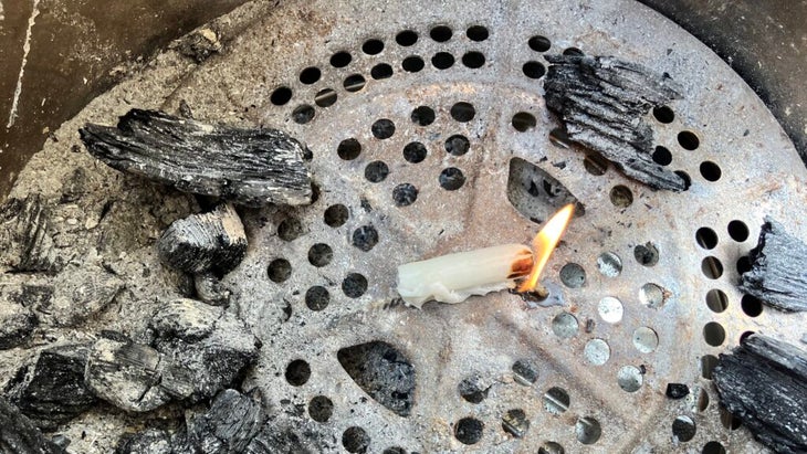 A tampon on fire in a firepit. 