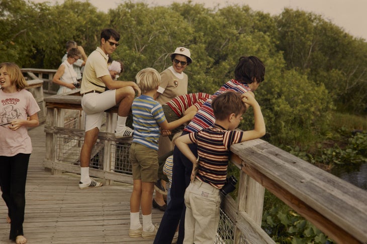 People on boardwalk with park ranger