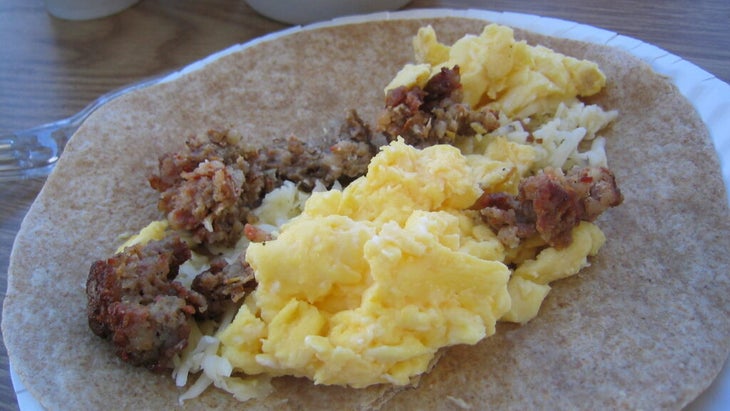 Sausage, egg, and cheese in a whole wheat tortilla