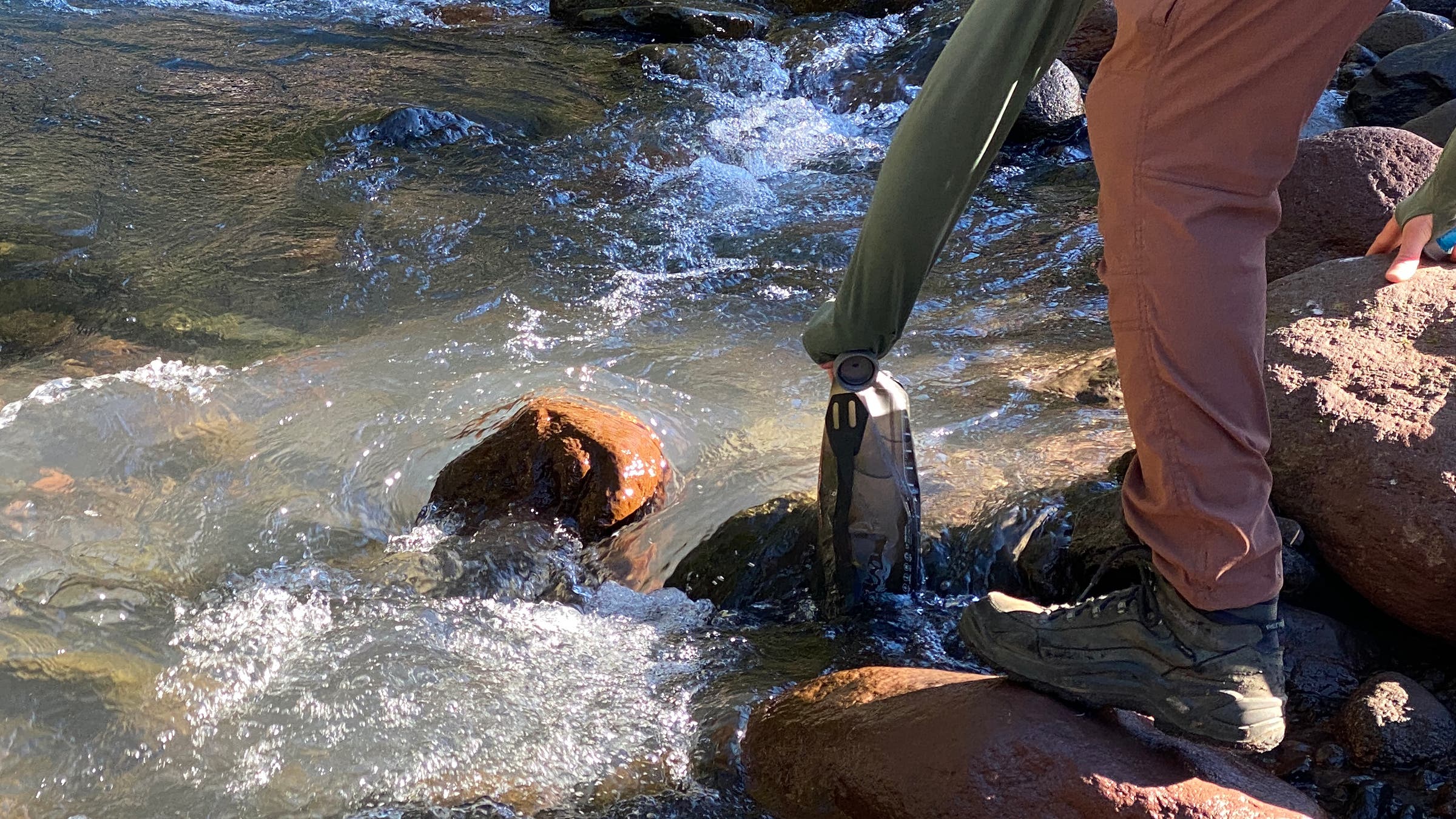 filling up water at a river