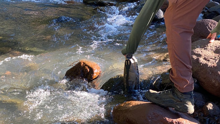 filling up water at a river