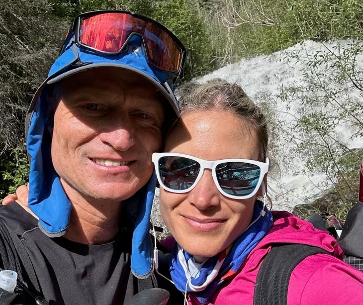 Andrew Hamilton and Andrea Sansone smile together on a trail