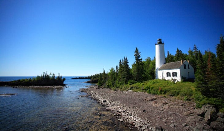 A lighthouse in Isle Royale National Park on a sunny day. 