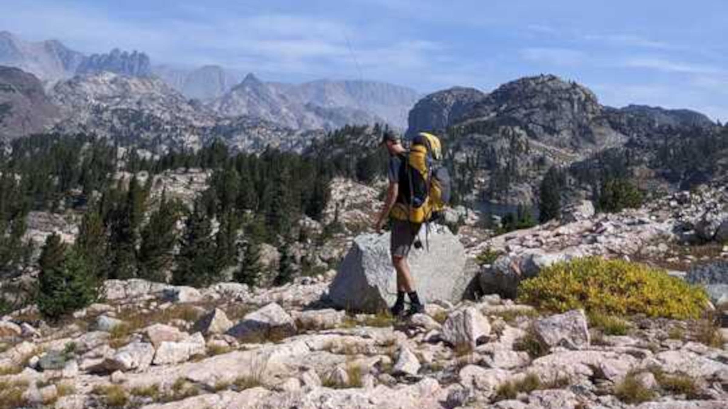 Hiker carrying backpack