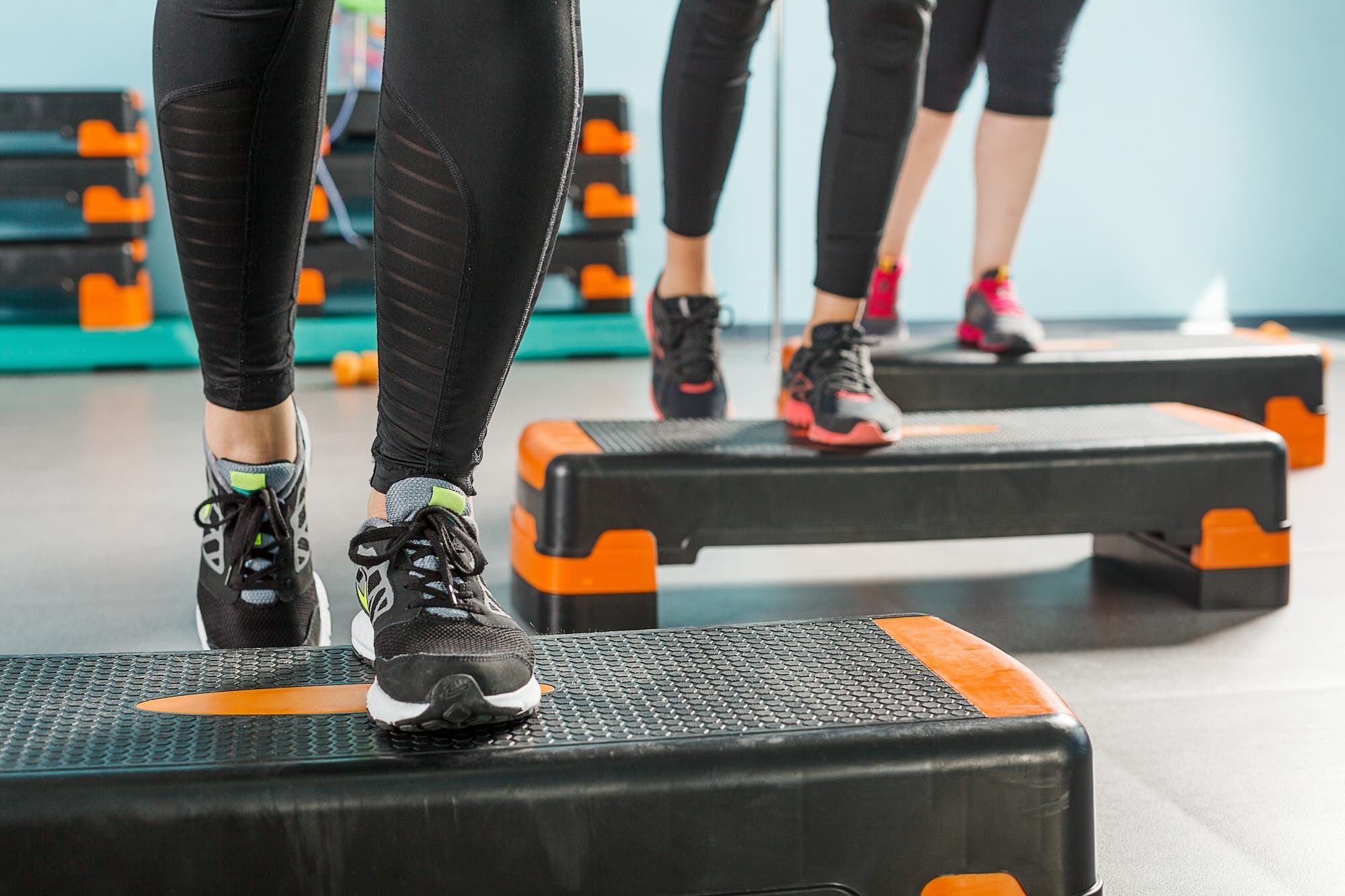 Close-up view of female legs exercising in gym