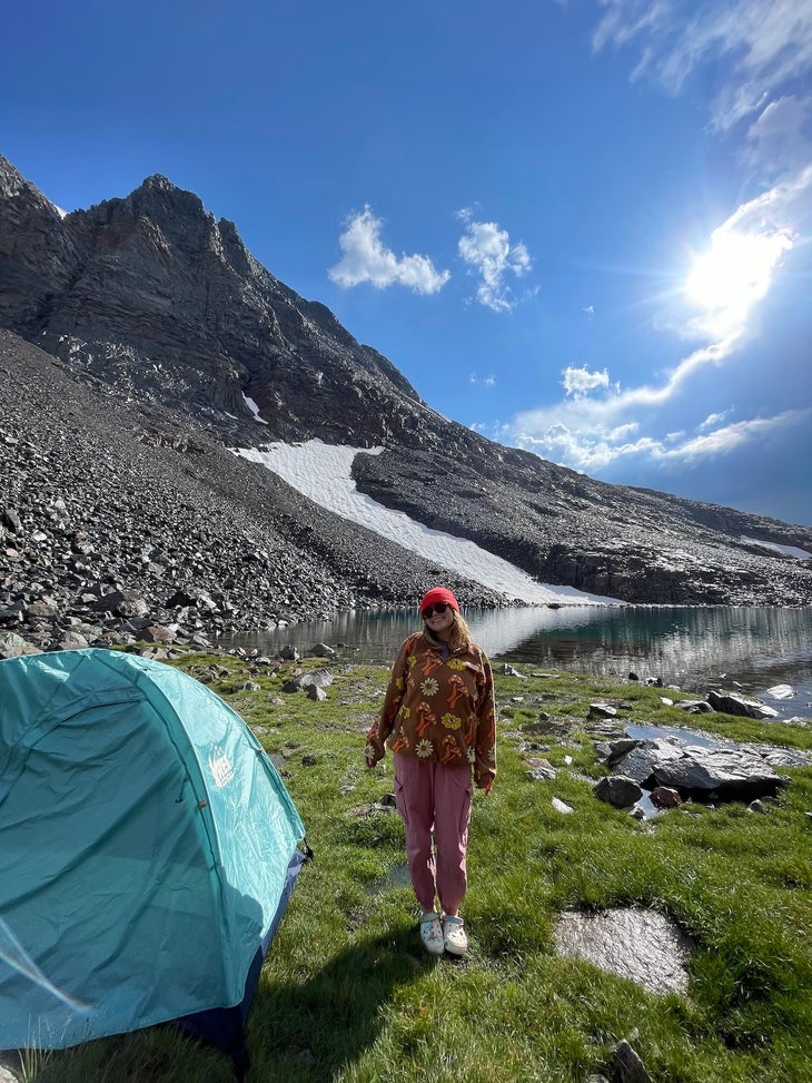 teaghan posing next to tent