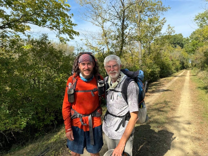 Two backpackers pose on the Ice Age Trail