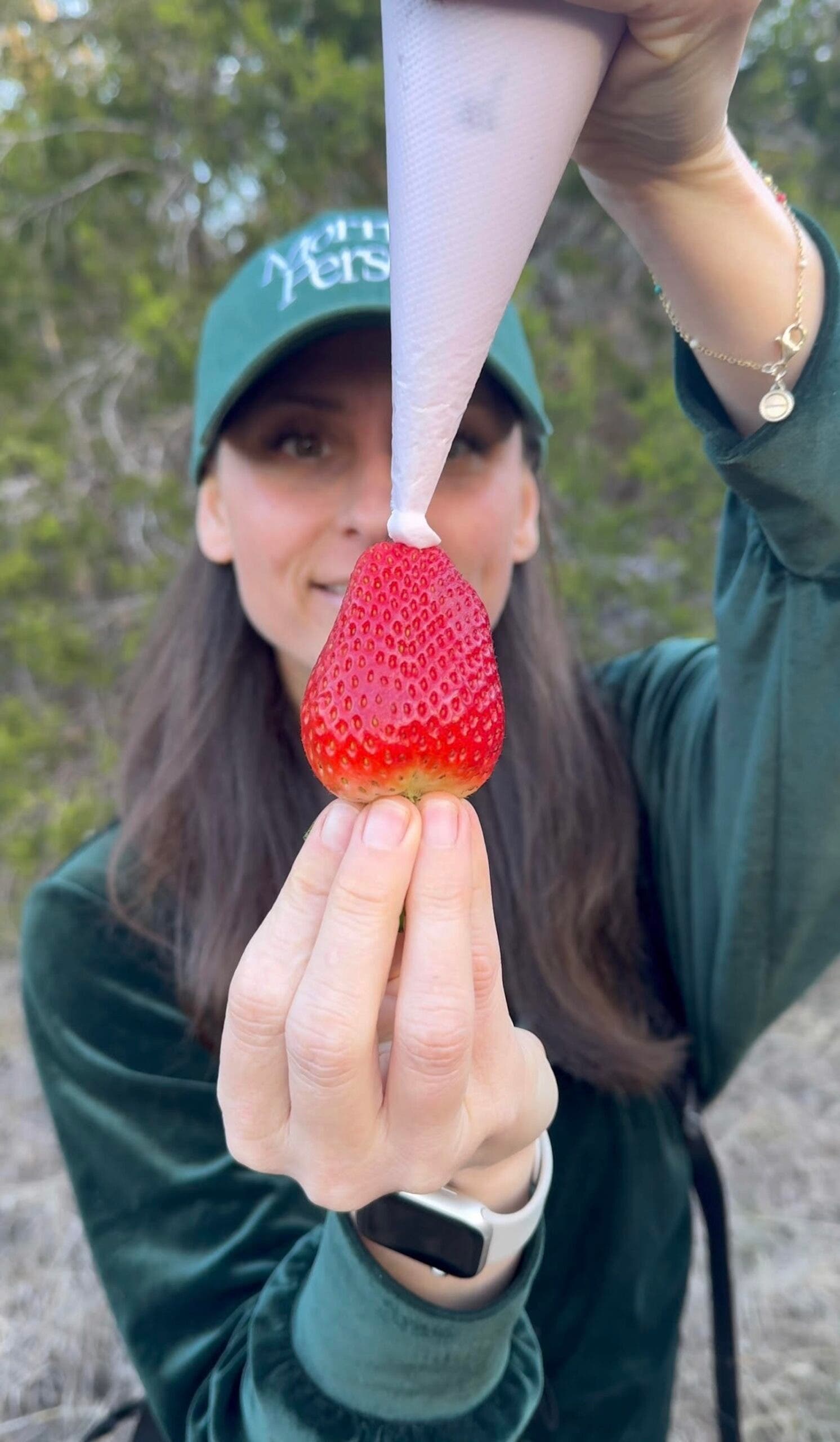 Baylee Chapo putting yogurt on fruit