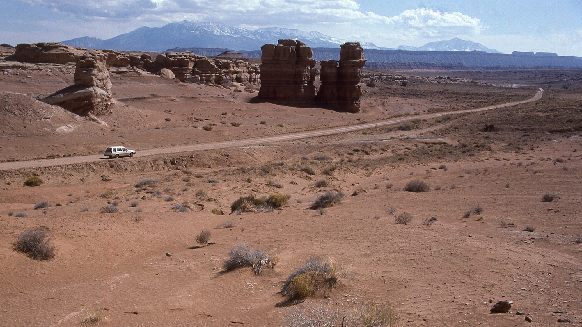 Notom-Bullfrog Road along the Waterpocket Fold in Capitol Reef National Park Utah with the Henry Mountains in the distance in winter