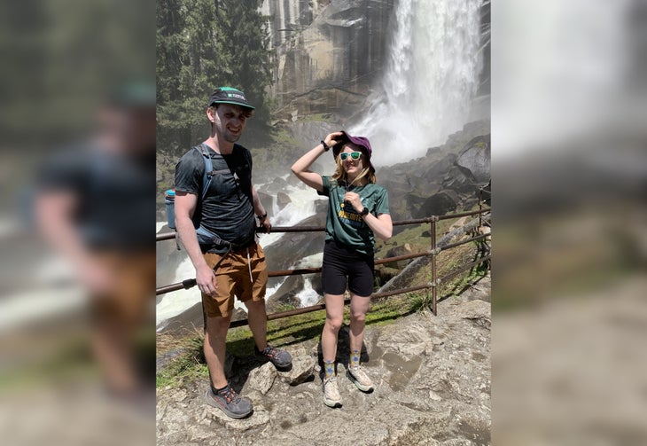 Two hikers in front of Nevada Falls in Yosemite