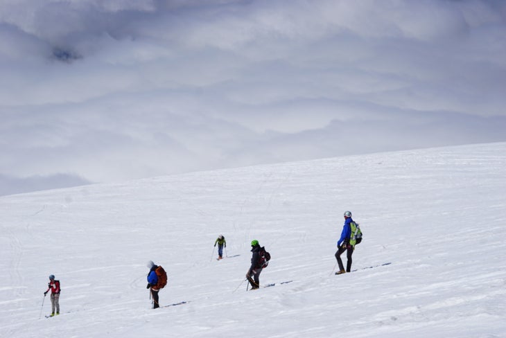 Hikers on snowy mountain