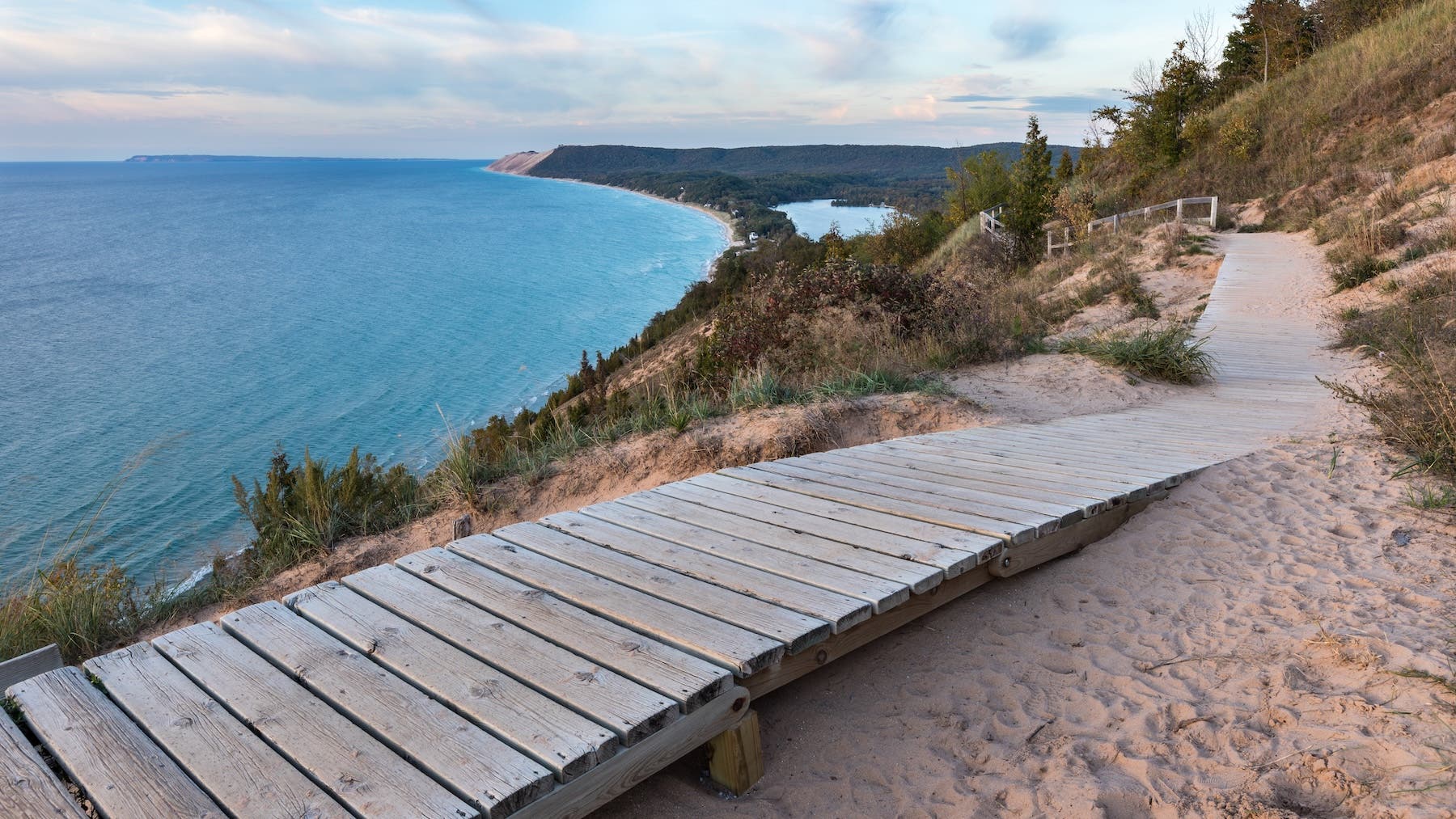 A weathered wooden walkway on the Empire Bluffs Trail