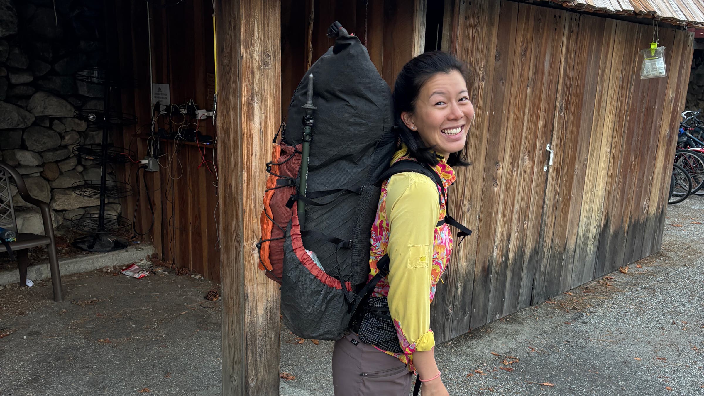 SWD Wolverine ultralight backpack text in front of hut