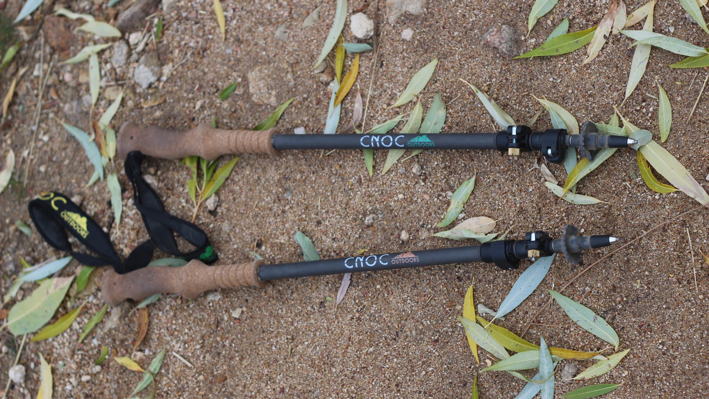 Diorite Gear Telescopic Carbon Fiber Trekking Poles laid on dirt