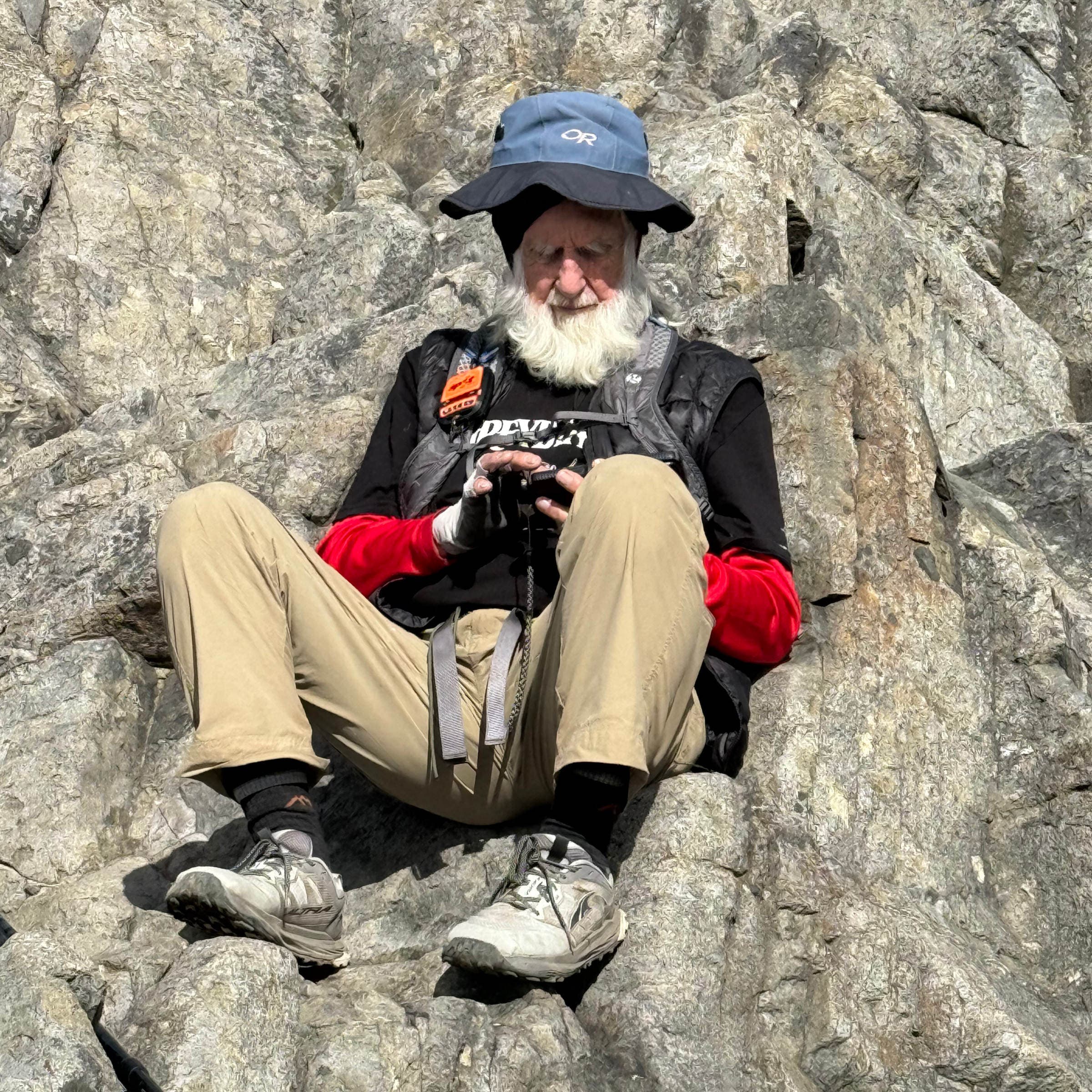 Greybeard sitting on talus