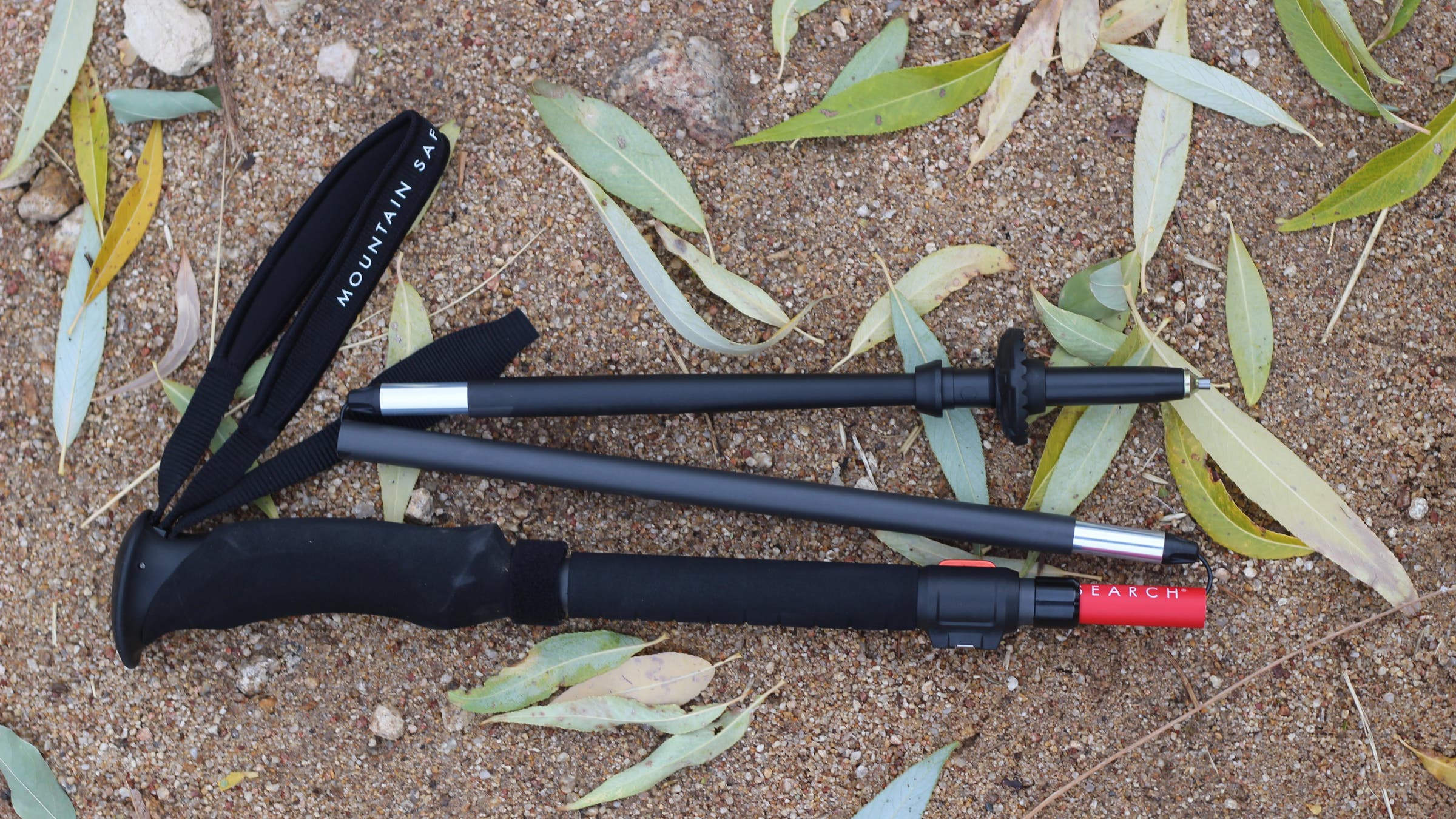 MSR Dynalock Ascent Carbon trekking poles on dirt