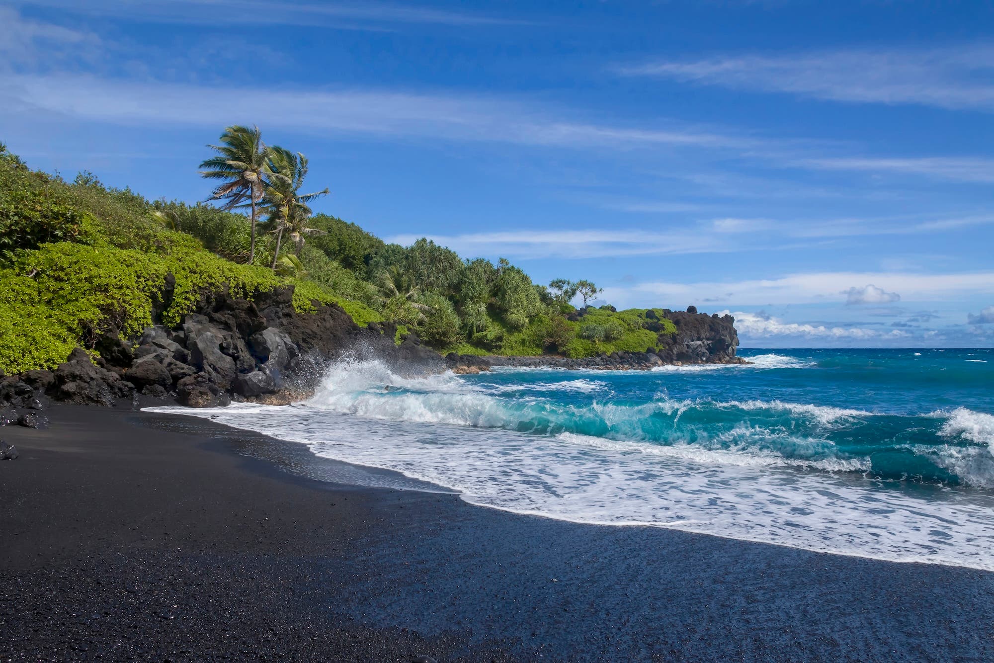 Waiʻanapanapa State Park located in the town of Hana, Hawaii feature beautiful volcanic black sand beaches and gorgeous coastline hiking trails that lead you spectacular views.