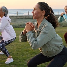 Hiker climbing steep rocky trail