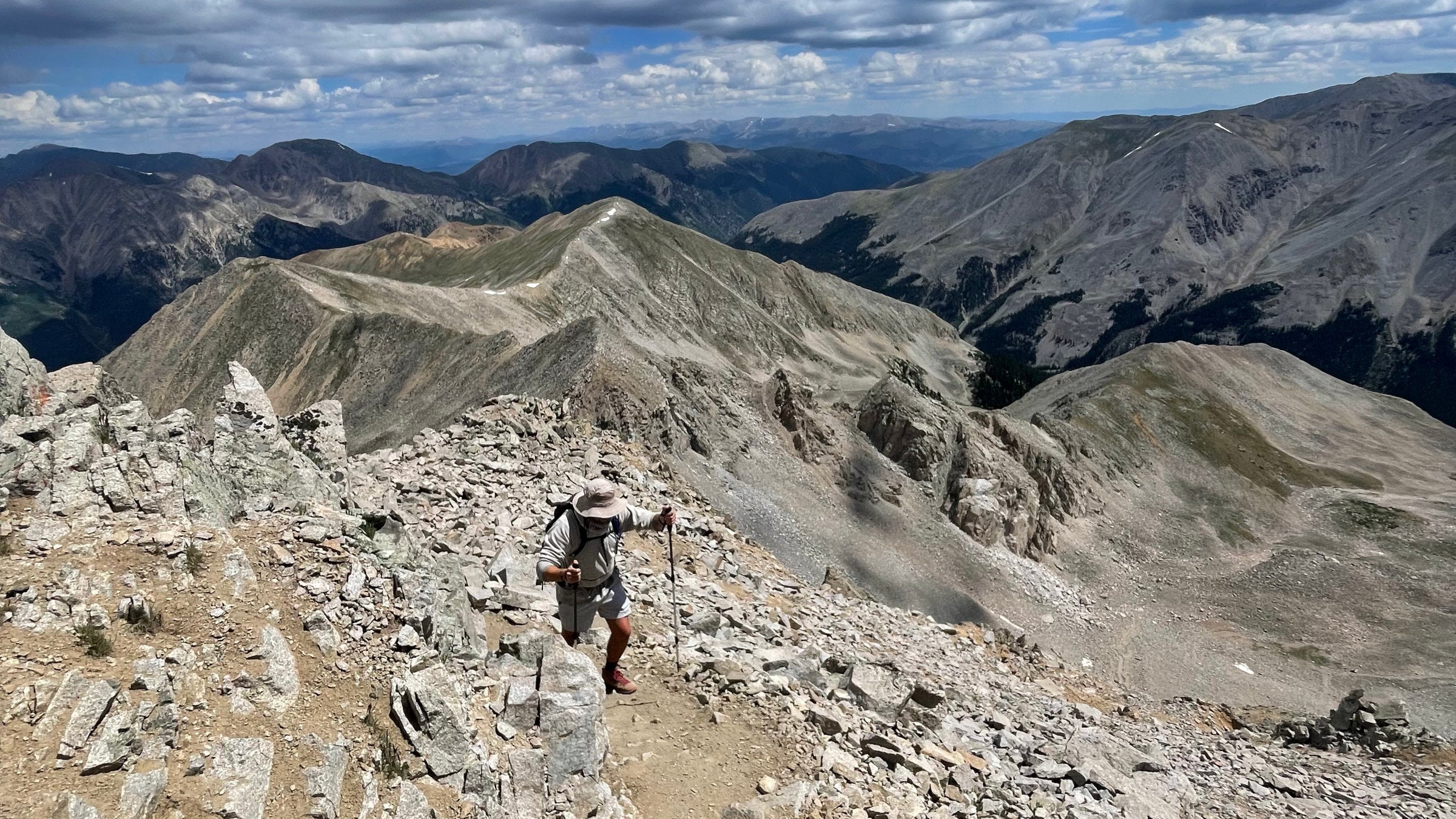 Hiker on talus-covered trail