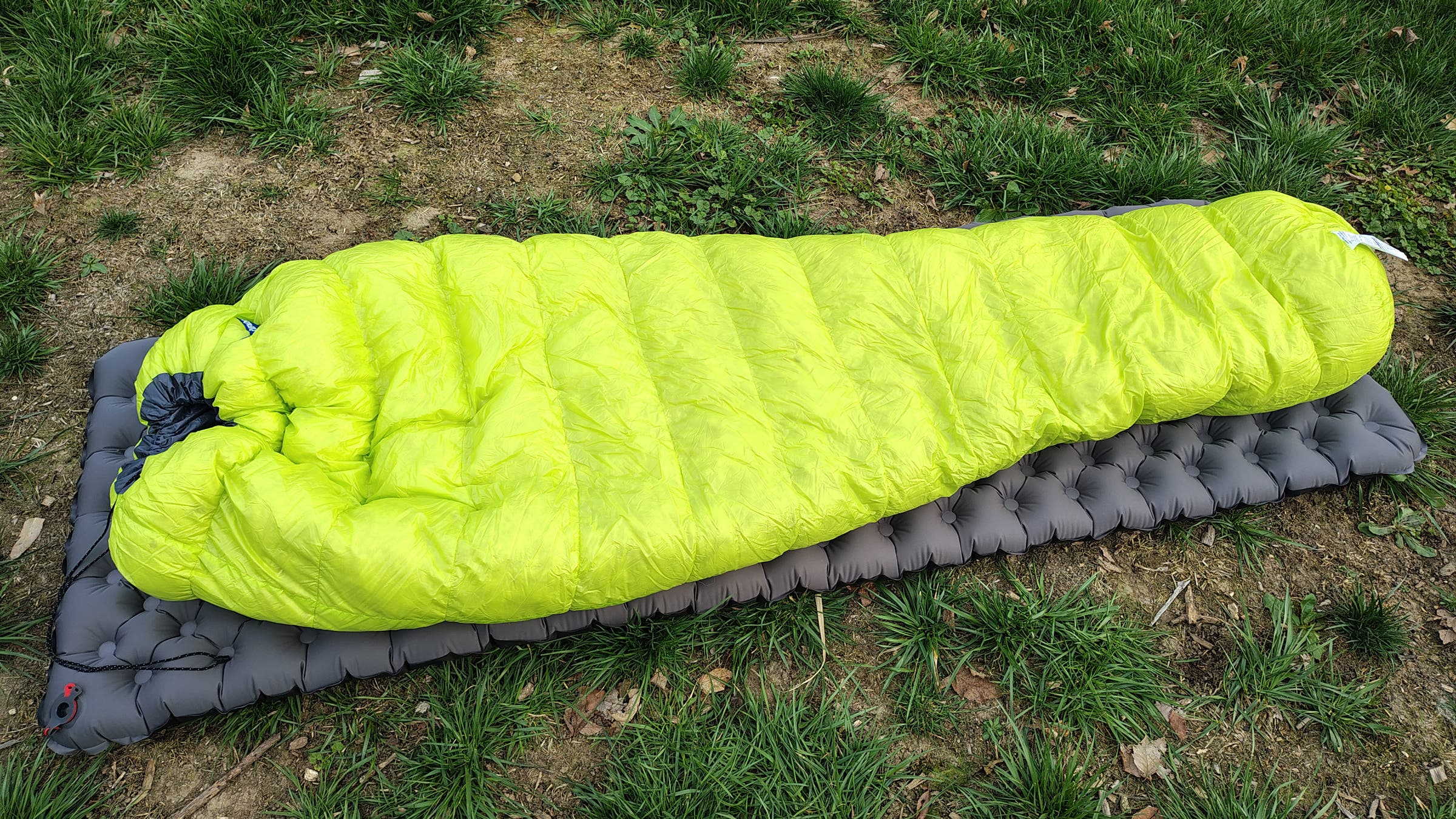 Feathered Friends Tanager CFL ultralight sleeping bag laid out on sleeping pad