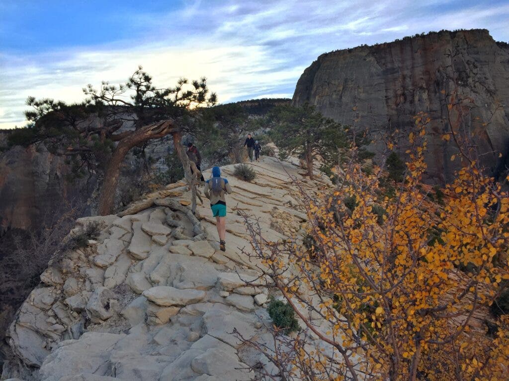 a trail runner on the Angel's Landing hike in zion national park