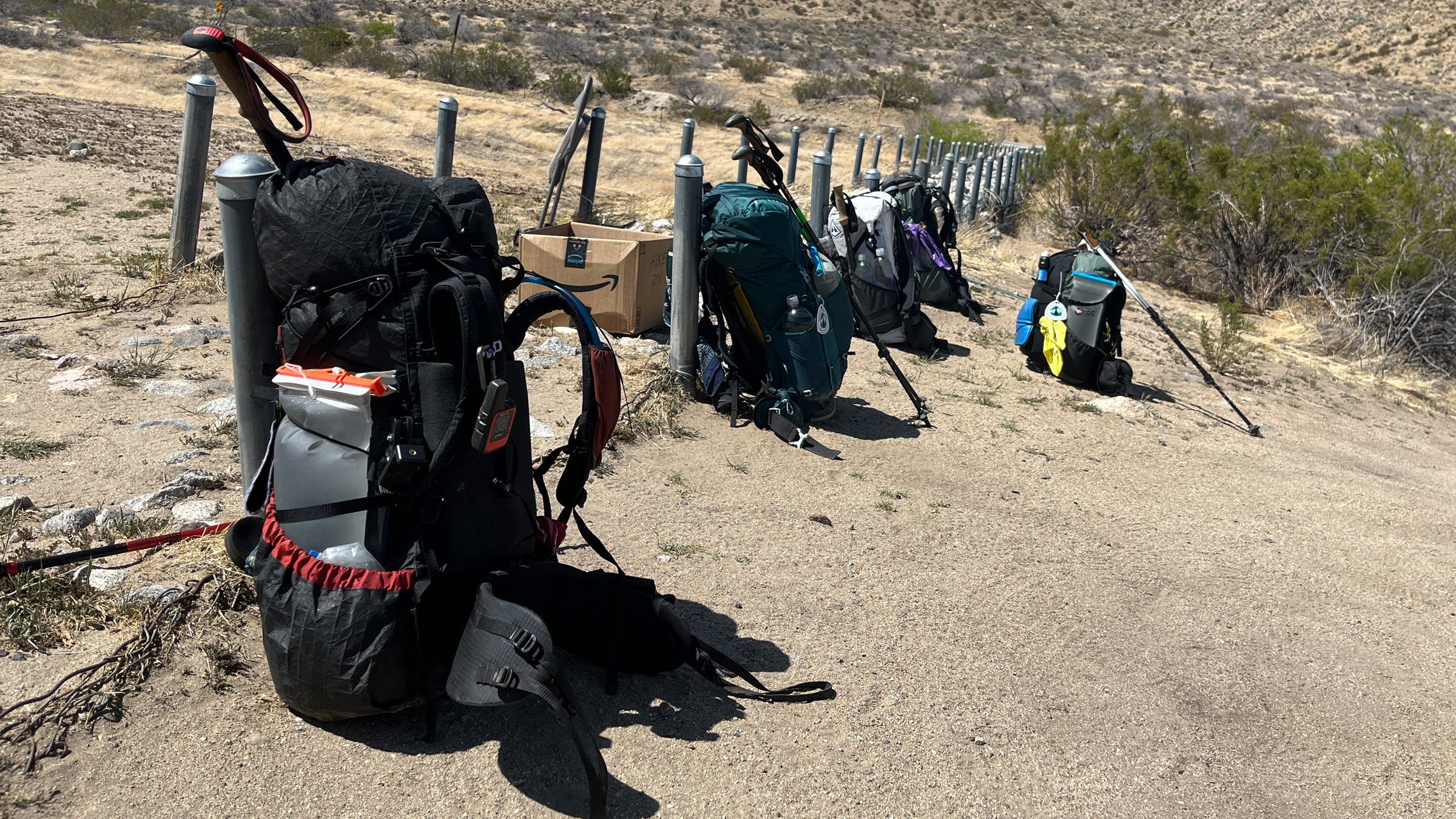 backpacks lined up on the PCT