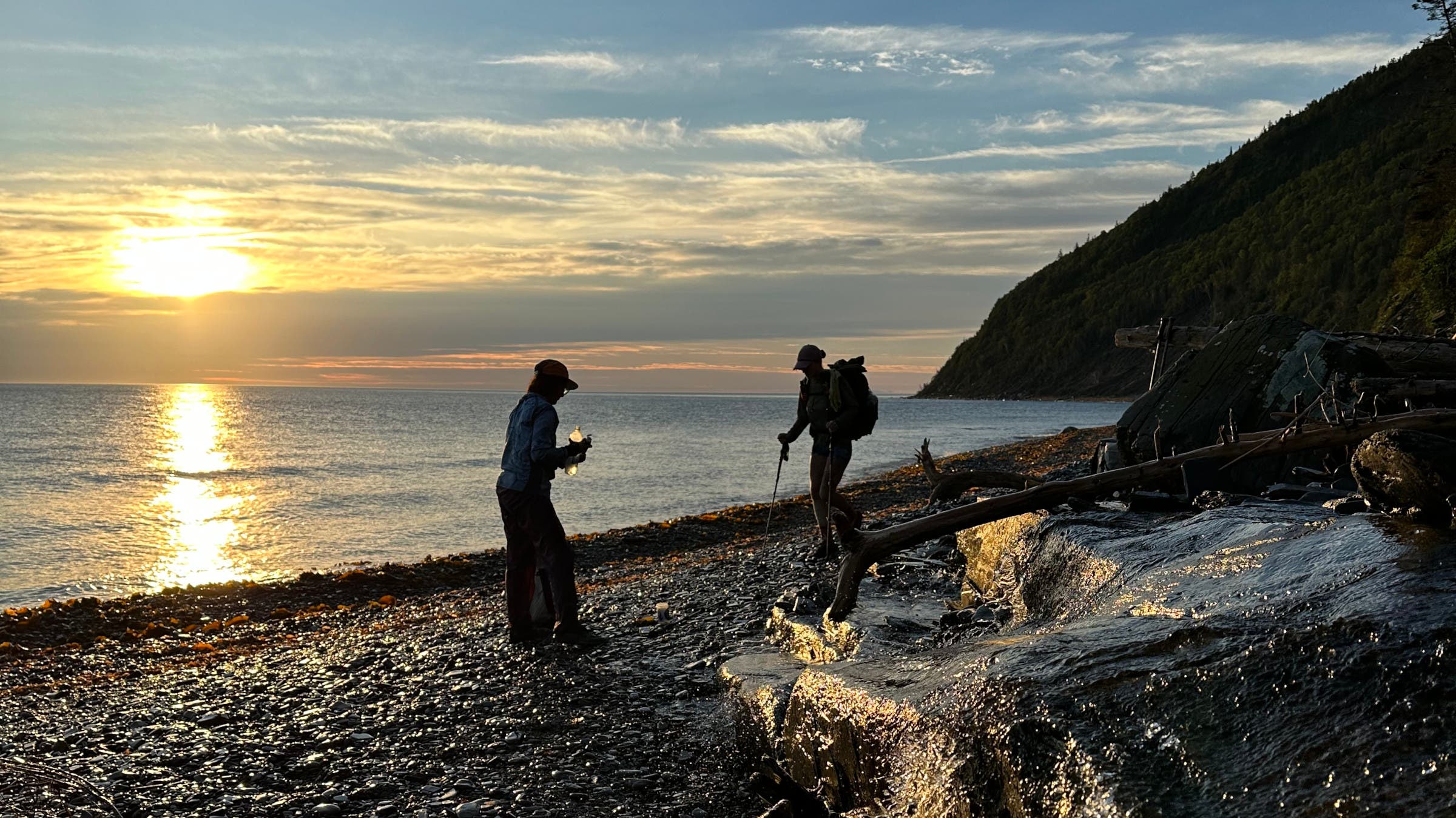 Hikers together on the shore